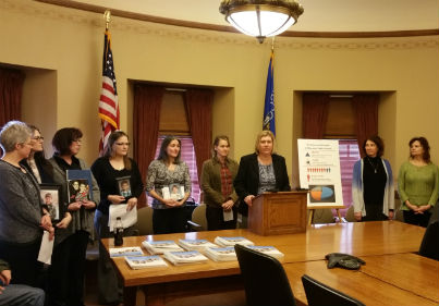 Staff members of Disability Rights Wisconsin and parent of victims speak out at press conference
