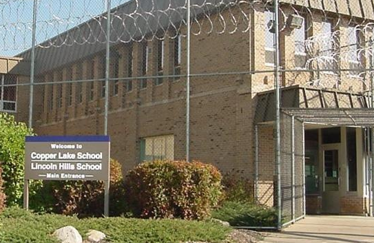 outside the barbed wire of Copper lake and Lincoln hill schools