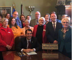 Advocates and legislators at bill signing with Governor Walker for support decision making