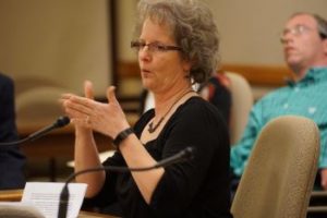 Denise Johnson testifying at public hearing