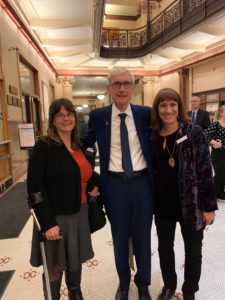 DRW staff standing with Governor Evers