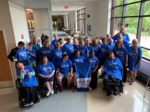 Group of people wearing Wisconsin Disability Vote Coalition t-shirts