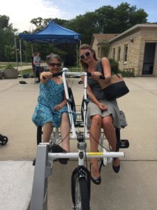 DRW Attorney Shirin Cabraal and intern Dena Welden on an adaptive bicycle