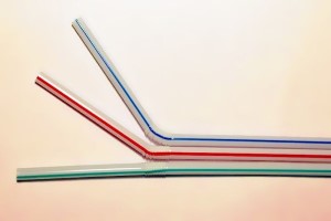 Three plastic drinking straws